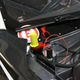 One of the fittings that can fill the battery box with fire-suppressing foam, right next to the pull that kills the electrical systems in the car in case of an emergency.